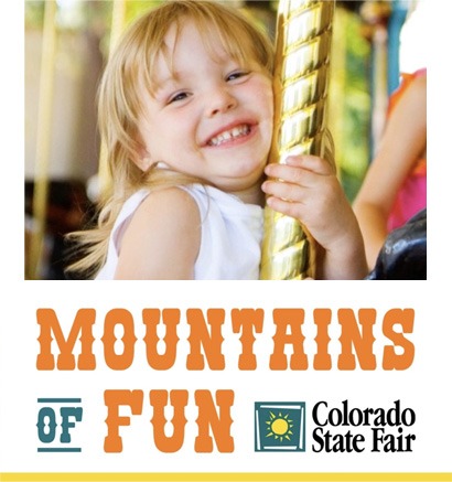 Mountains of Fun - Colorado State Fair - Child enjoying a Merry Go Round