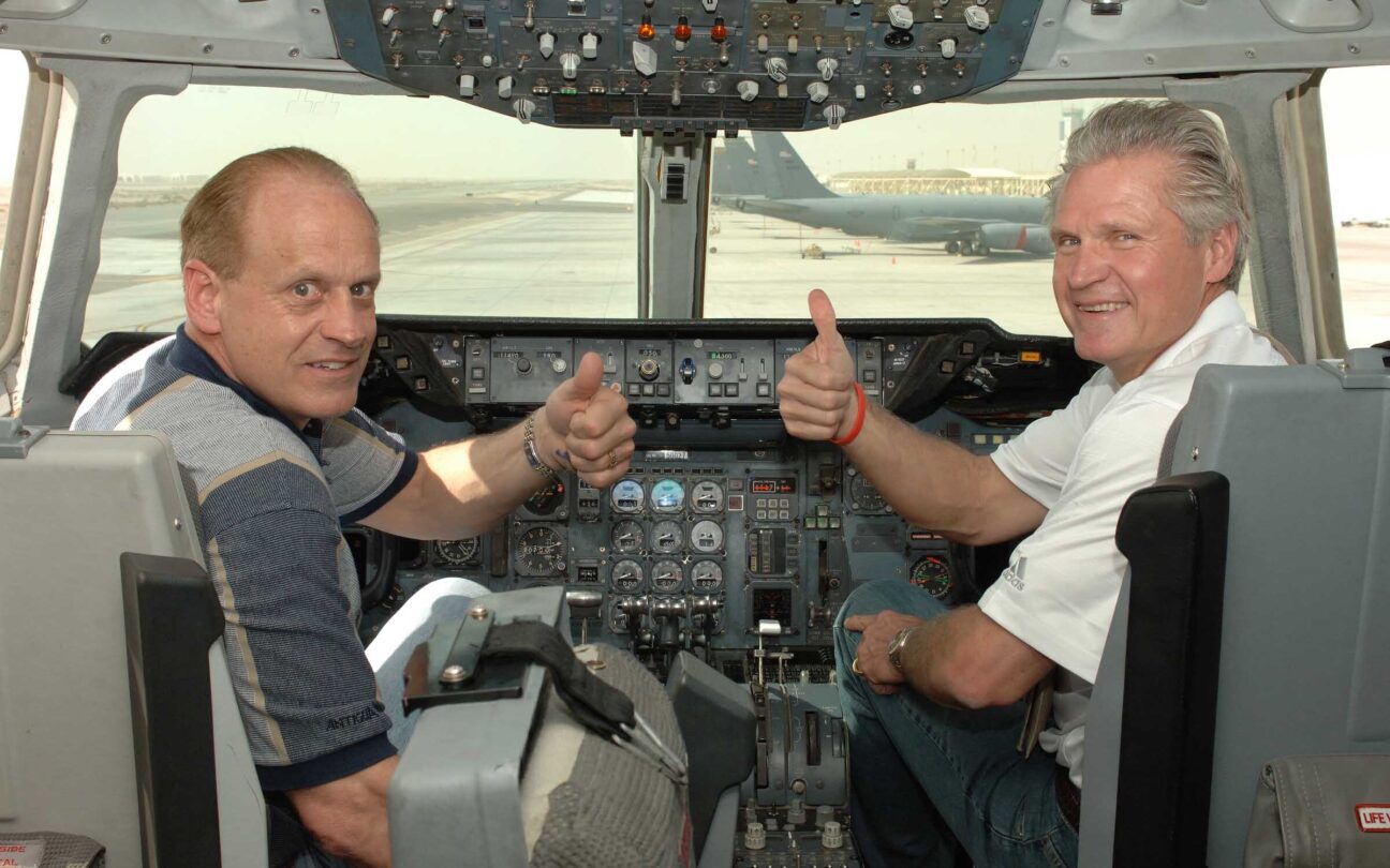 Randy Gradishar in plane cockpit with military pilot